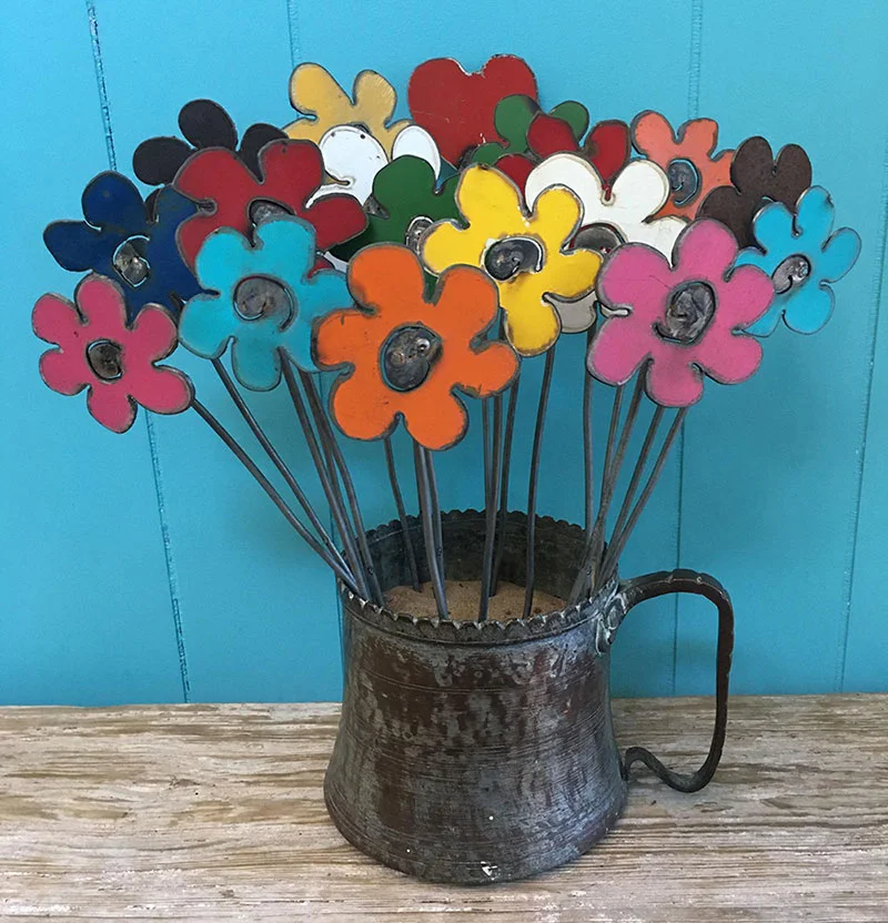 An unusual gift idea for beginner gardeners: decorative garden art like these rustic metal flowers